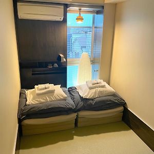 Kamer met Twee Aparte Bedden in Japanse Stijl